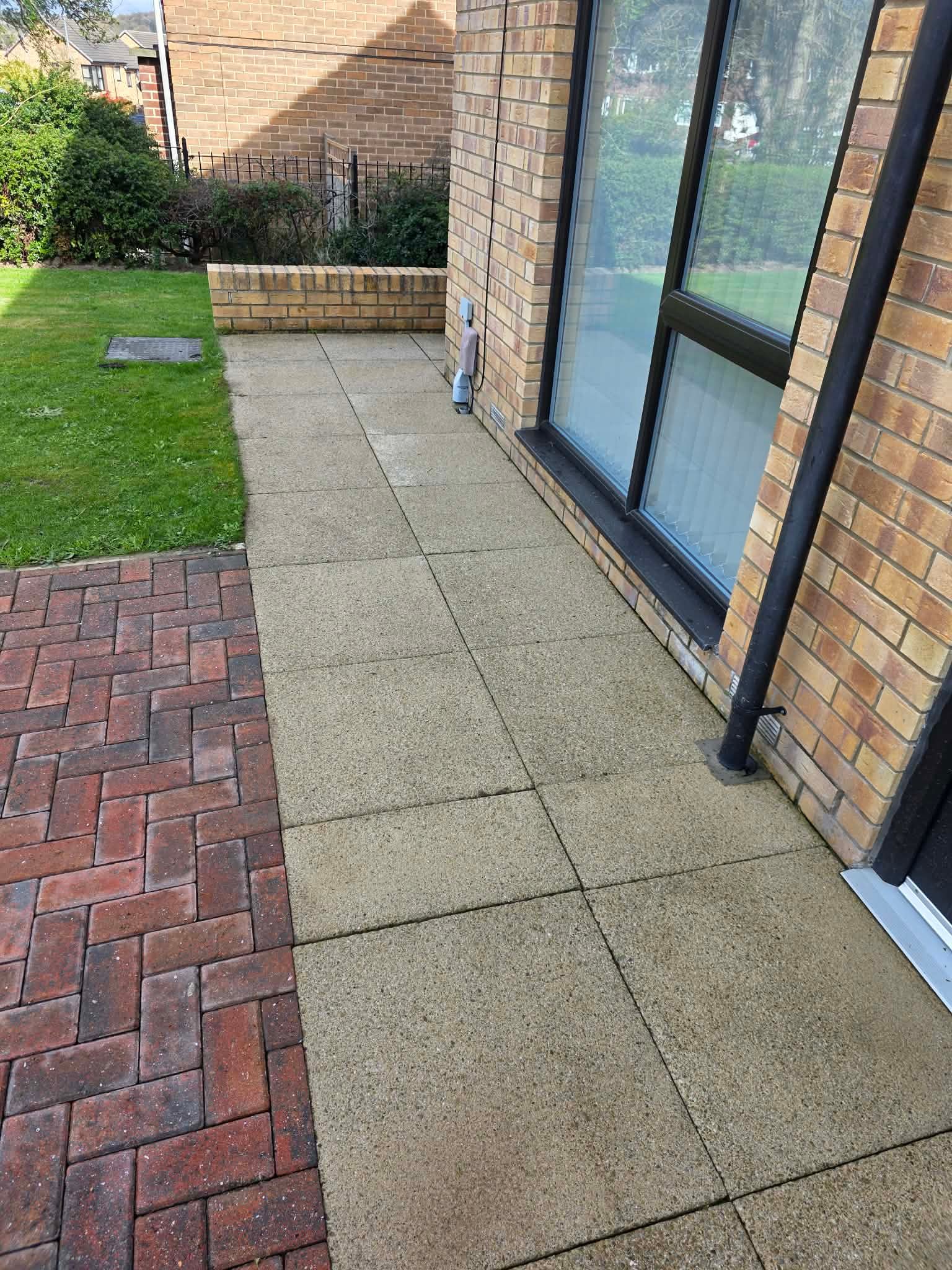 Pressure washing a garden path in Wakefield