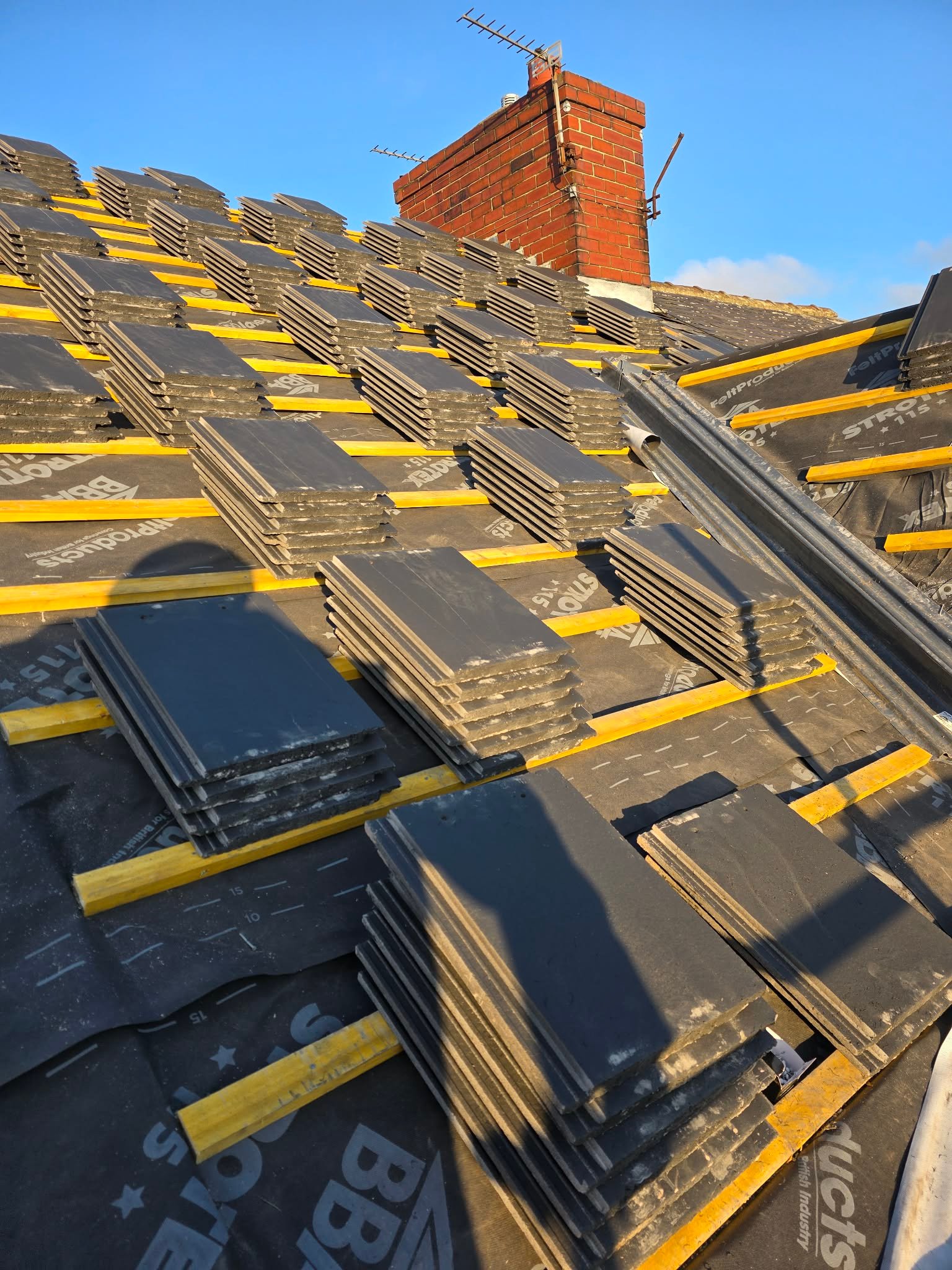 Roof tiles being installed during re-roof in Doncaster