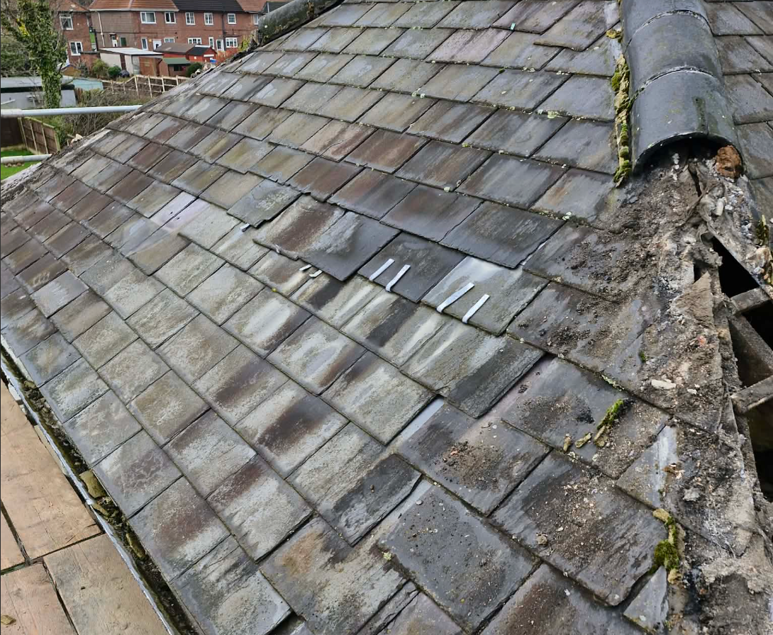 Side view of a worn roof needing repair by Maizey and Co Ltd